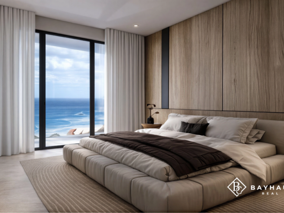 Luxury primary bedroom with panoramic ocean view at L’Aquila Aruba