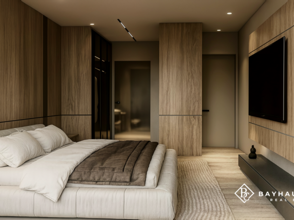 Contemporary primary bedroom with custom wood finishes at L’Aquila Aruba