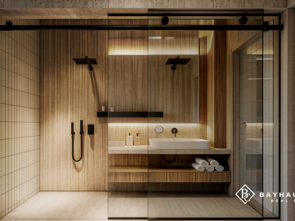 Luxury glass-enclosed shower and vanity at L’Aquila Aruba