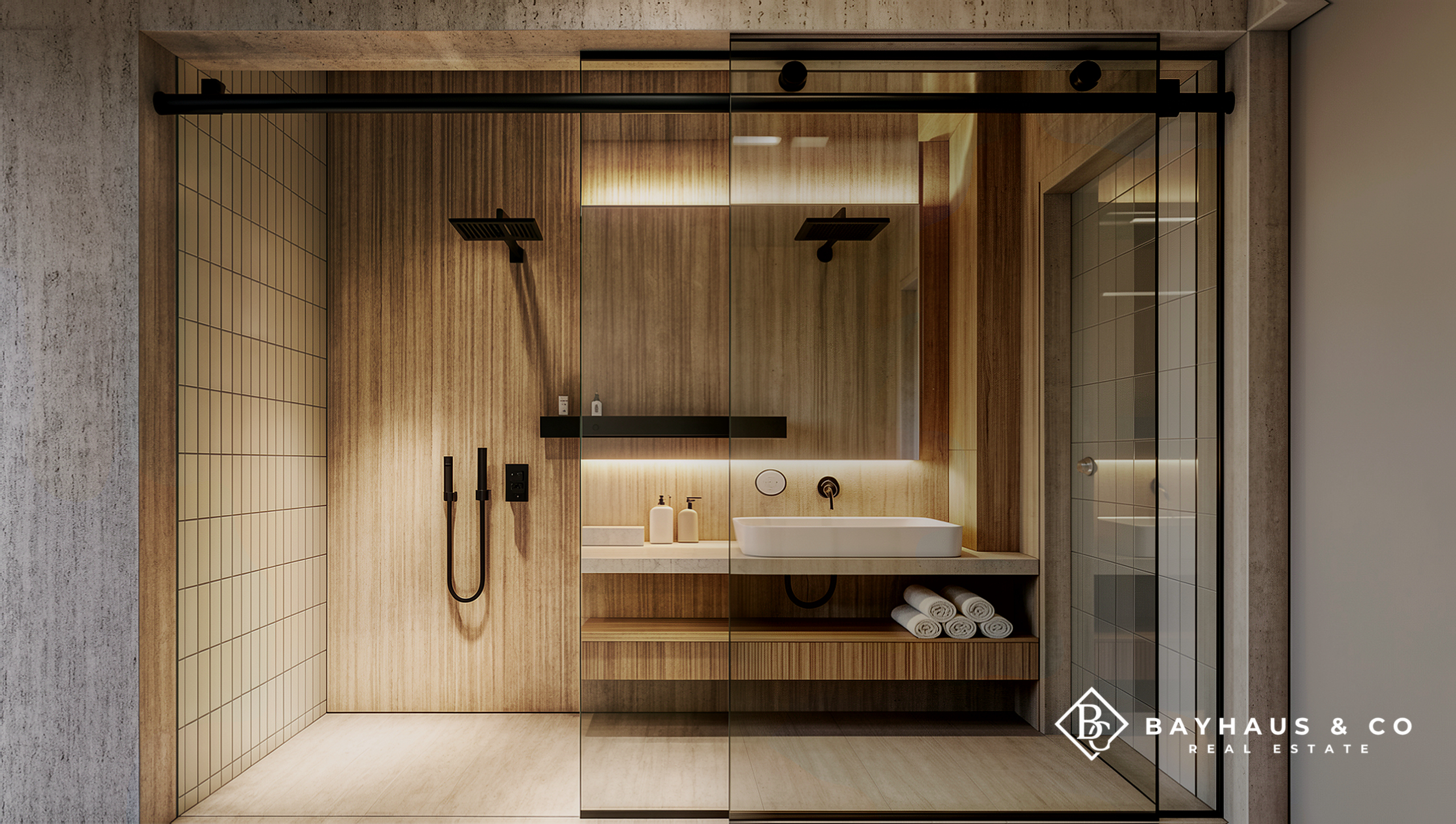 Luxury glass-enclosed shower and vanity at L’Aquila Aruba