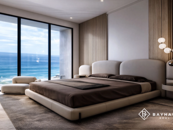 Luxury primary suite with floor-to-ceiling ocean views at L’Aquila Aruba