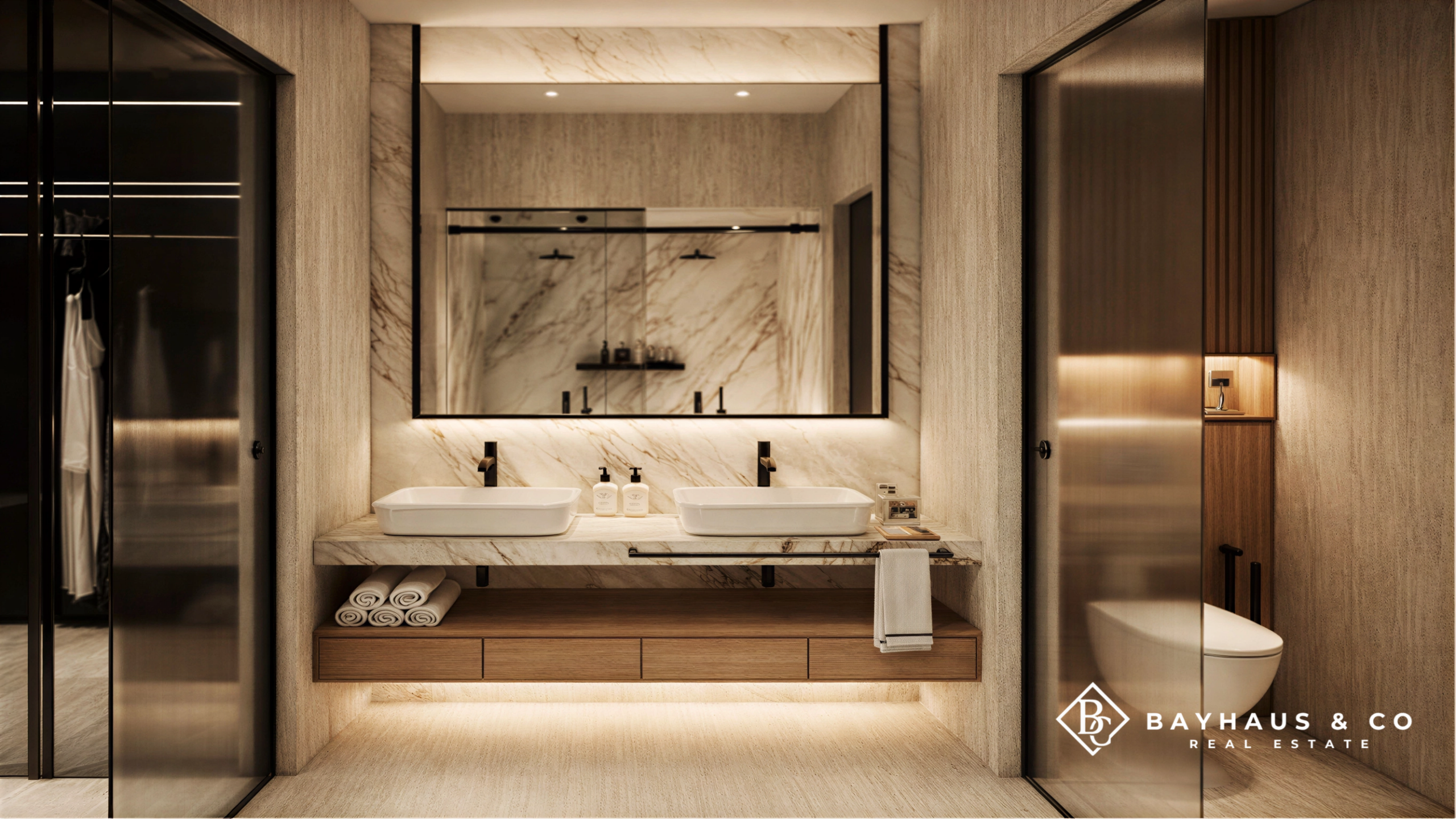 Luxury bathroom with double vanity and marble finishes at L’Aquila Aruba
